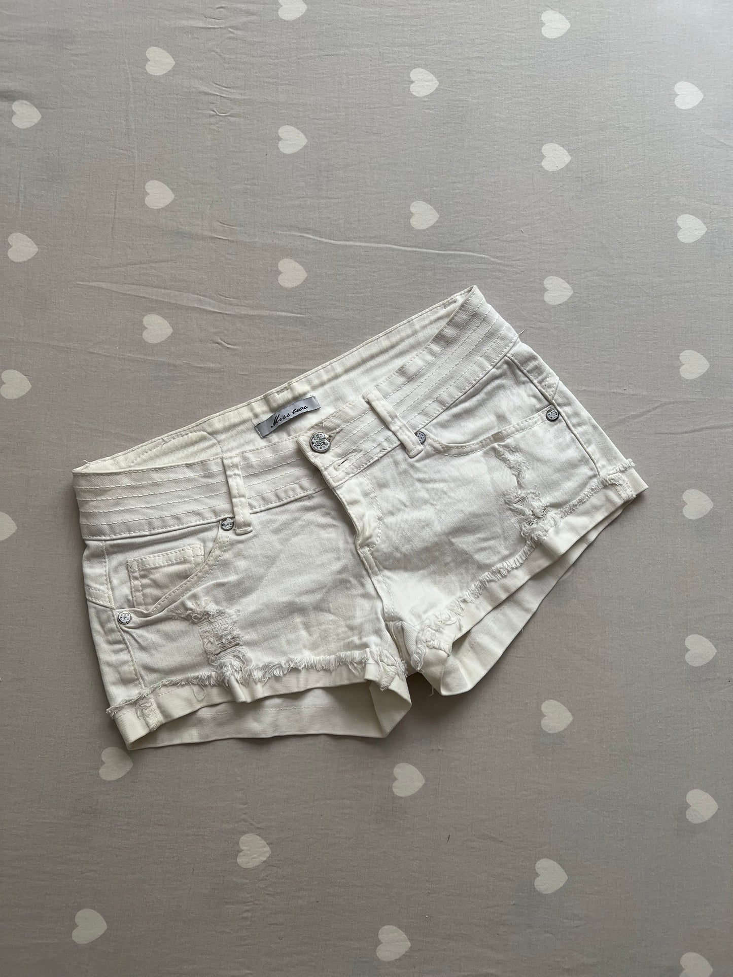 White distressed shorts