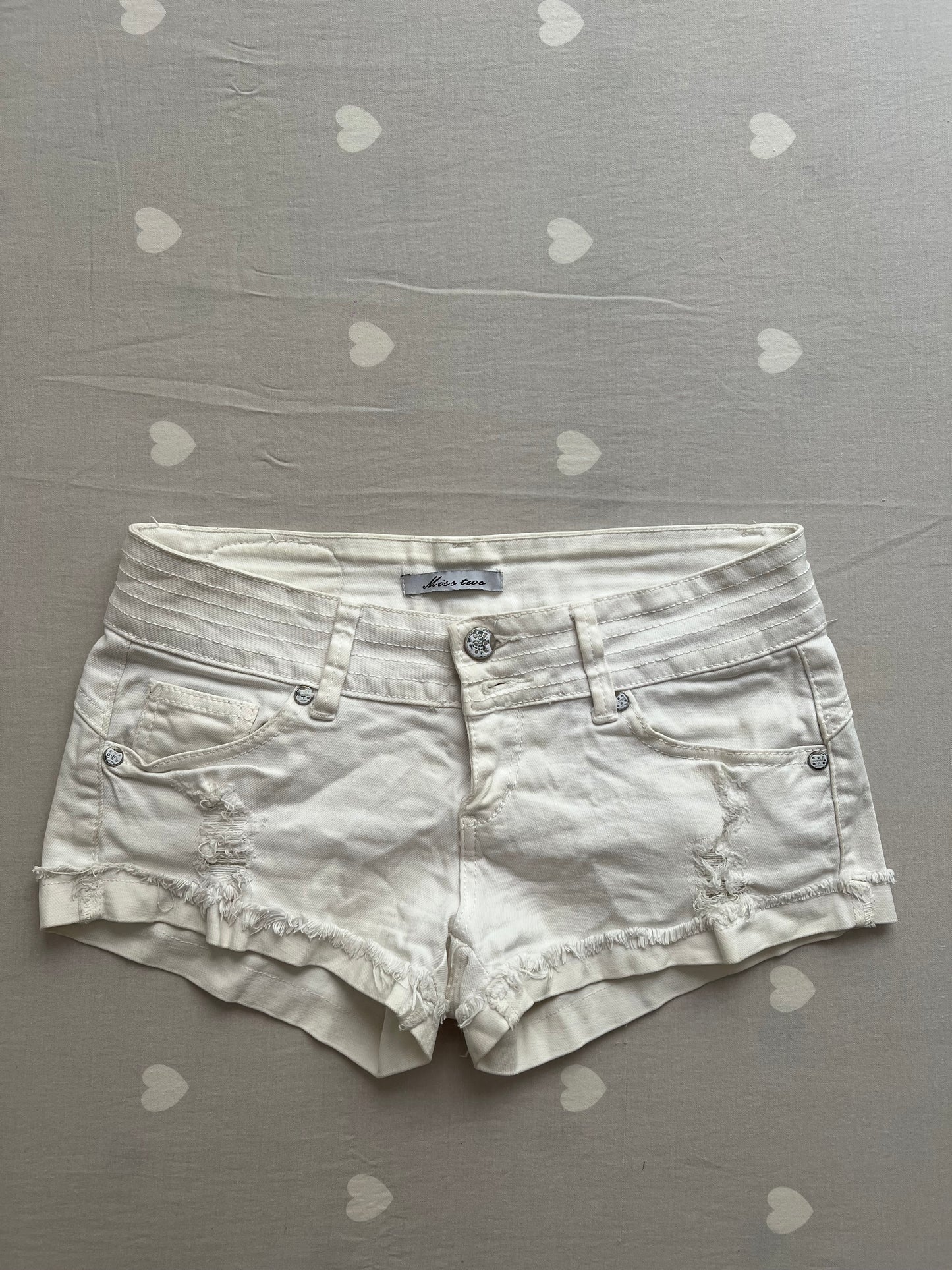 White distressed shorts